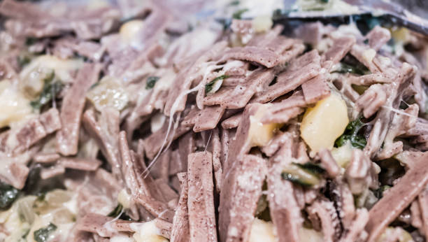 close up of the succulent and typical italian dish pizzoccheri. typical dish from valtellina, lombardy, italy. - pizzoccheri homemade tagliatelle italy imagens e fotografias de stock