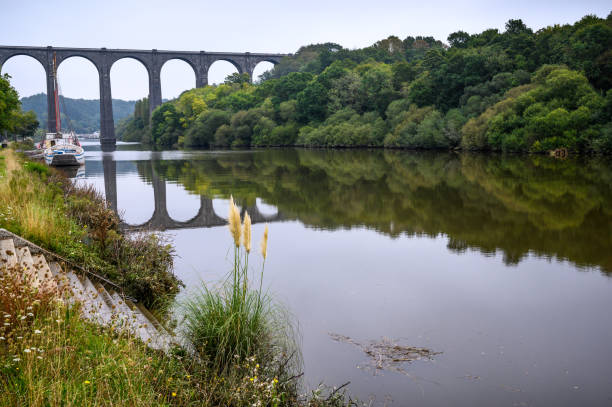 istock Boat on the river in front of a viaduct 1285297788