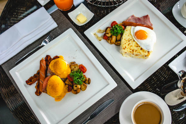 istock Eggs Benedict toasted English muffins. Delicious breakfast with eggs Benedict 1285298593