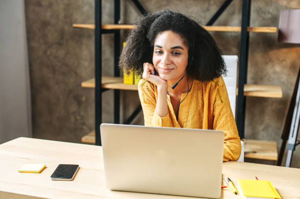 istock An african-american woman with hands free headset 1285301842