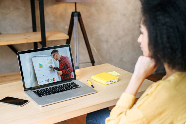 istock An african-american woman watching webinar 1285301892
