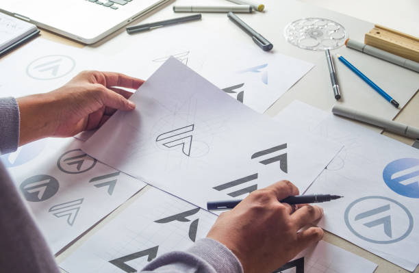 istock Graphic designer creative design sketch drawing logo Trademark brand Workspace 1285303286