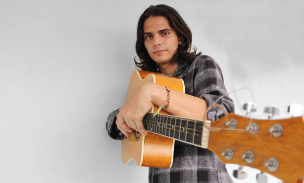 istock A young boy plays a guitar and composes songs 1285303325