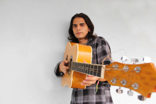 istock A young boy plays a guitar and composes songs 1285303352