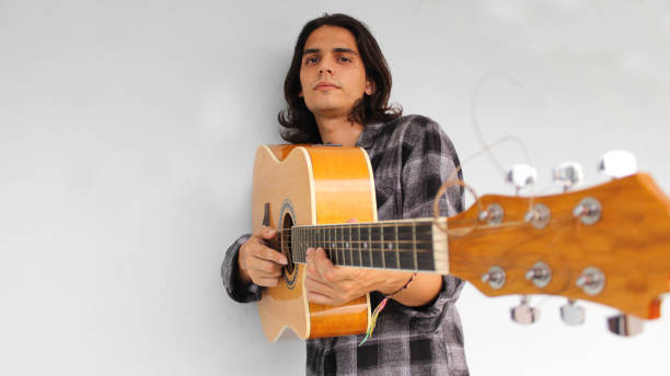 istock A young boy plays a guitar and composes songs 1285303402
