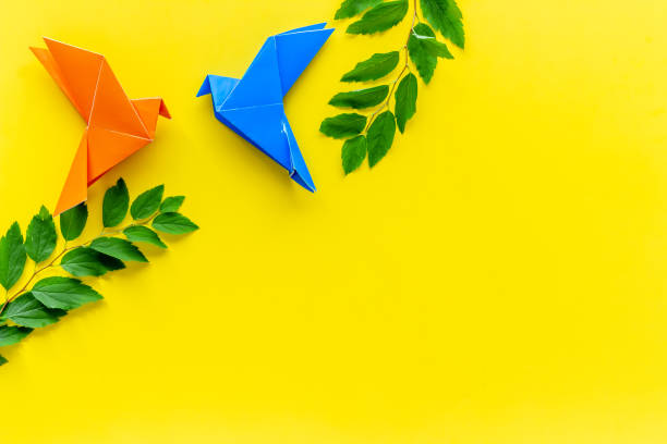 istock Colored origami - paper birds with leaves, overhead view 1285303721