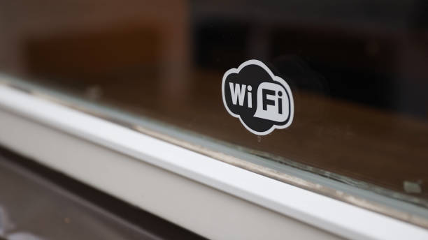 istock Small black and white Wi-Fi sticker on window 1285304747