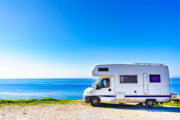 Rv caravan camping on sea shore Camper rv caravan on mediterranean coast in Spain. Wild camping on sea shore. Holidays and travel in motor home. rv stock pictures, royalty-free photos & images