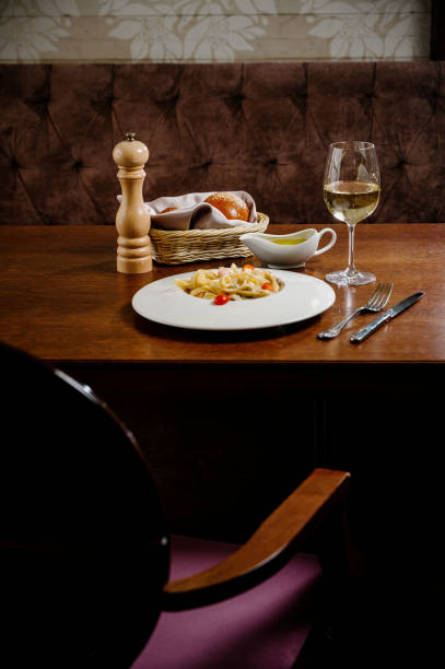 istock Plate with delicious Chicken Alfredo on table 1285306992