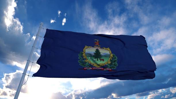 istock Vermont flag on a flagpole waving in the wind, blue sky background. 3d rendering 1285307570
