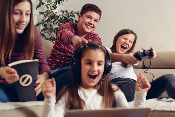 istock Teenagers playing video game at home. 1285308151
