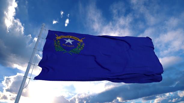 istock Nevada flag on a flagpole waving in the wind, blue sky background. 3d rendering 1285308524