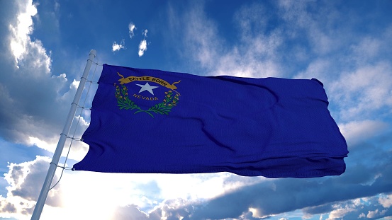 Nevada flag on a flagpole waving in the wind, blue sky background. 3d rendering.