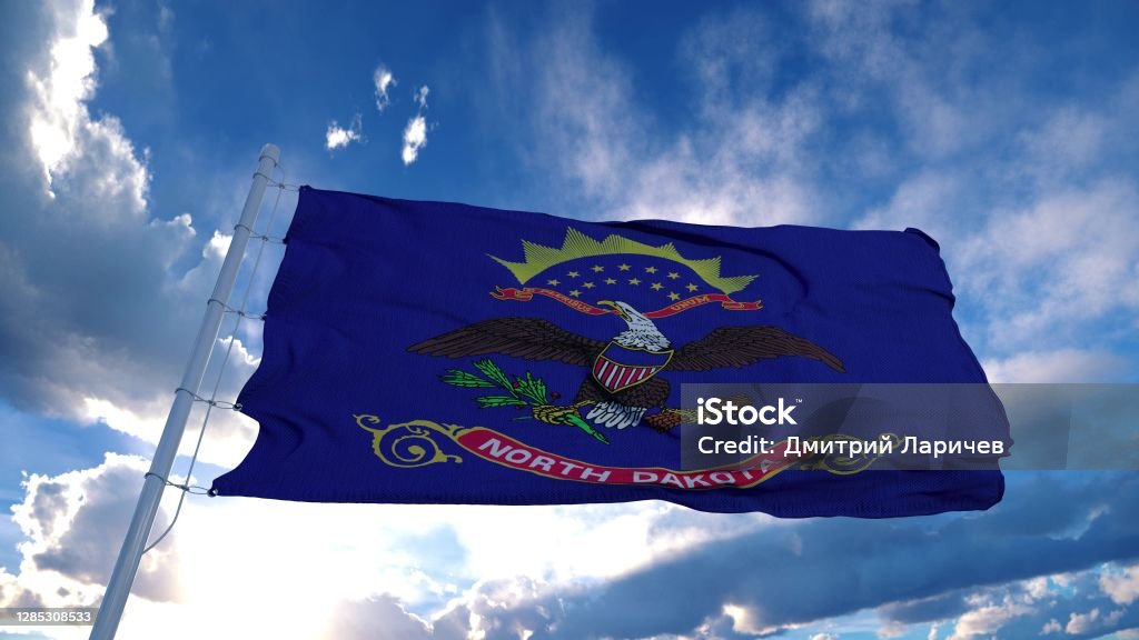North Dakota flag on a flagpole waving in the wind, blue sky background. 3d rendering North Dakota flag on a flagpole waving in the wind, blue sky background. 3d rendering. Dakota - Illinois Stock Photo