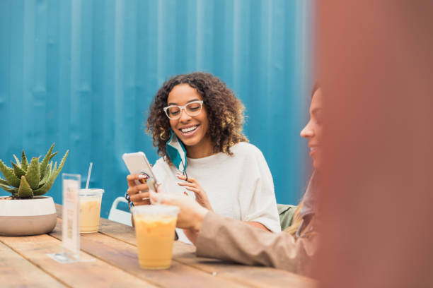 istock Women take selfies at patio restaurant 1285308686