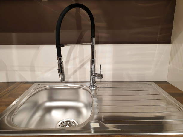 istock Modern stainless steel sink in the kitchen 1285309398