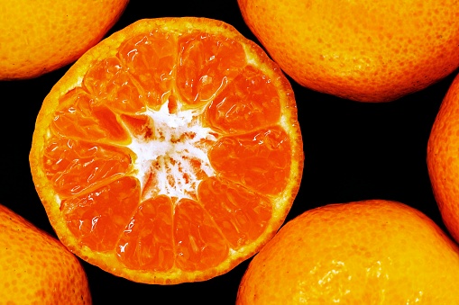 Macro texture of ripe cut orange