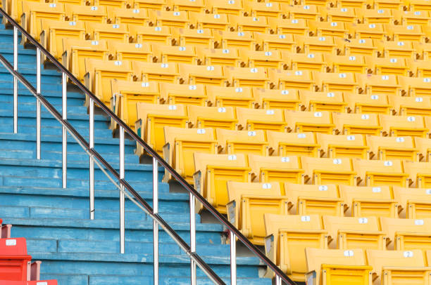 Empty yellow seats at stadium,Rows of seat on a soccer stadium,select focus