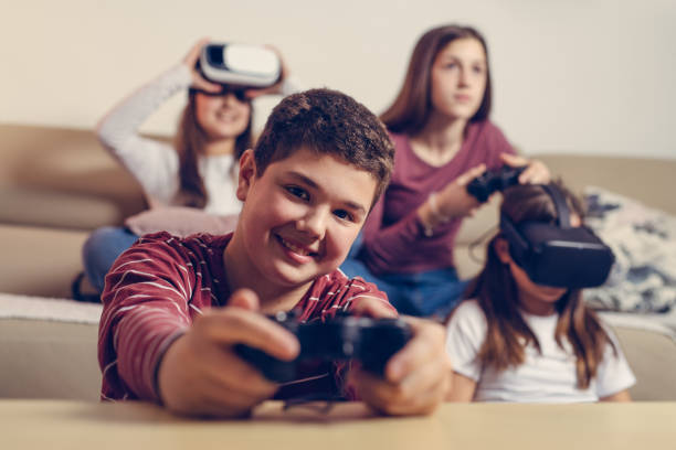 istock Teenagers playing video game at home. 1285309739