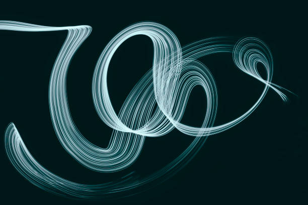 istock Abstract blue green swirl light trail motion painting 1285309874