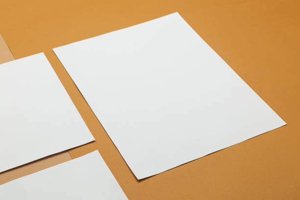 istock Blank paper poster brochure a4 size mockup template on beige background 1285310007