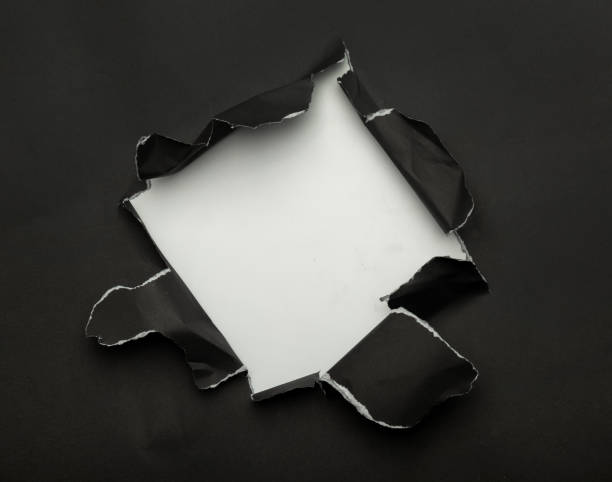 istock Black torn paper on white background. Black Friday campaign 1285310073