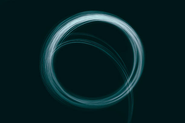 Abstract blue green circle light trail motion neon painting on black background