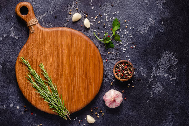 istock Herbs and condiments on black stone background 1285311292