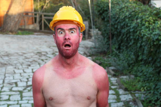 istock Hilarious construction worker with tank top tan lines 1285311424