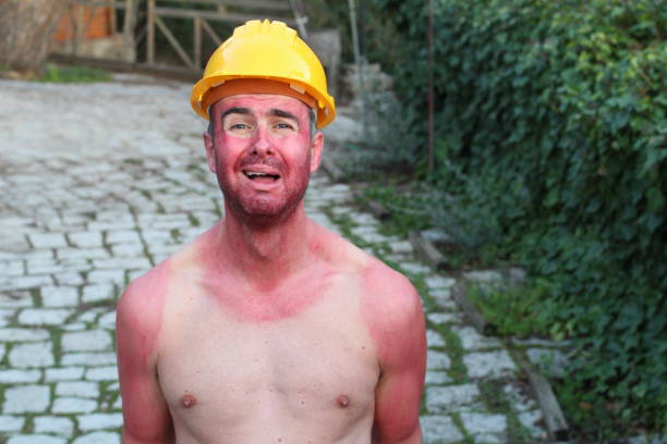 hilarious construction worker with tank top tan lines - tank top fotos imagens e fotografias de stock