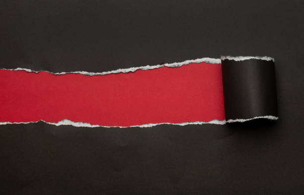 istock Black torn paper on red background. Black Friday campaign 1285311705