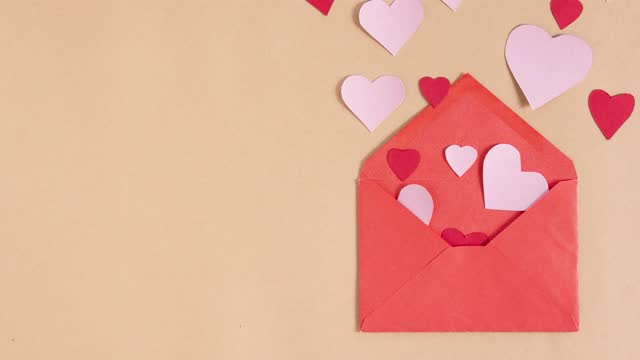 stop motion animation with red paper envelope and flying hearts on beige background. copy space. love, valentines day and wedding greeting concept