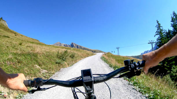 POV perspective view of e-biking along mountain slope