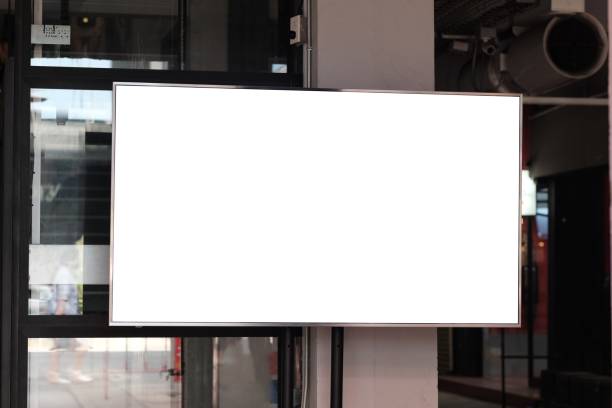 istock White LCD TV screen attached to the wall. 1285314815