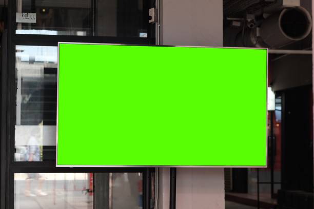 istock Green screen LCD TV attached to the wall. 1285314828