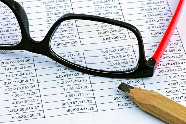 istock Eyeglasses and pencil on financial statement report. 1285315062