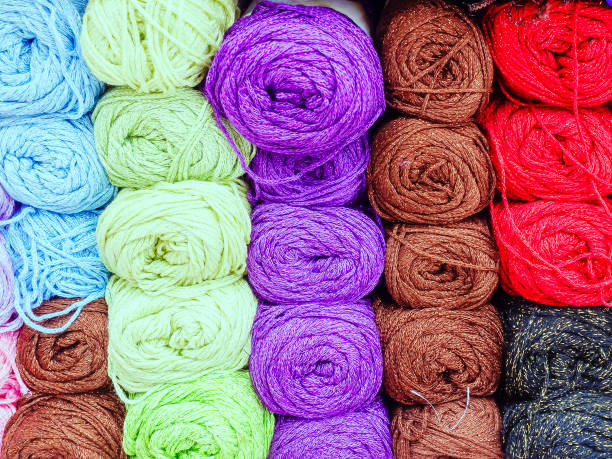 istock Many colored skeins of thread tightly packed. Full screen photo 1285315522