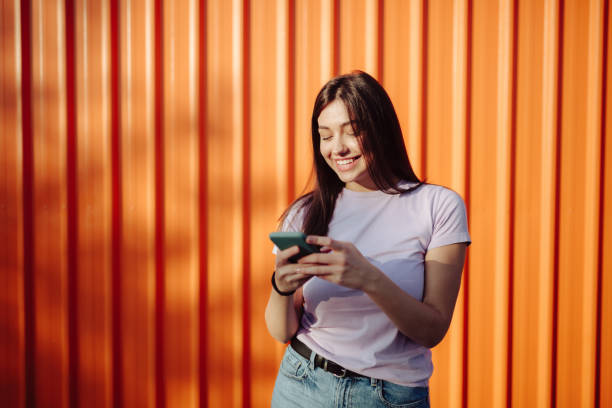istock Happy young Caucasian woman using a smart phone 1285316276