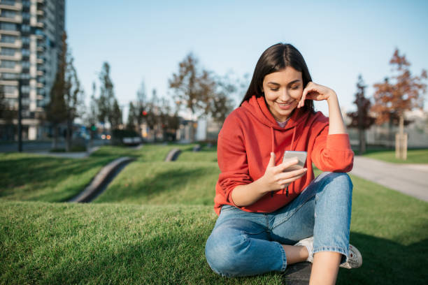 istock Happy young Caucasian woman using a smart phone 1285316466