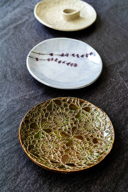 istock Handmade Ceramic Plates and Trays. Handcrafted with Traditional Ottoman Pattern on Dark Surface and Backround / Handicraft. 1285318634