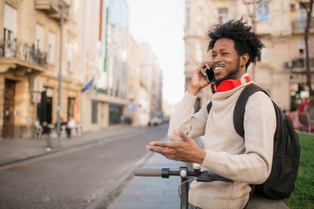 istock Handsome African American young male student using a smart phone 1285321086