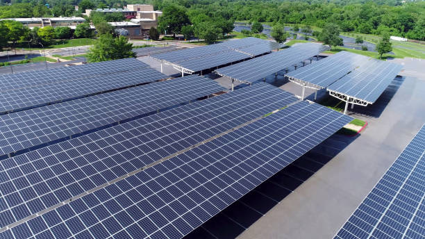 istock high aerial view of empty solar panels on parking roof. 1285322806
