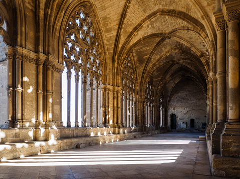 Indoor cloister in the Cathedral of St. Mary of La Seu Vella, in Lleida, Catalonia, Spain. Covered gallery.