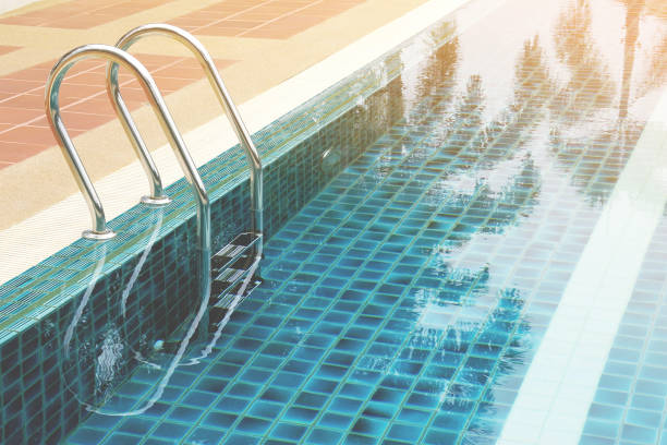 istock Swimming Pool  with Clear Water and Ladder 1285326249