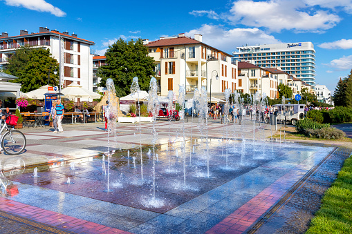 Swinoujscie, Poland - Septebmer 23, 2020:The main promenade leading to the beach with fountain, restaurants, bars and shops and new apartment buildings in summer day at Swinoujscie, Poland. Swinoujscie is a tourist resort in the west pomeranian voivodeship in Poland