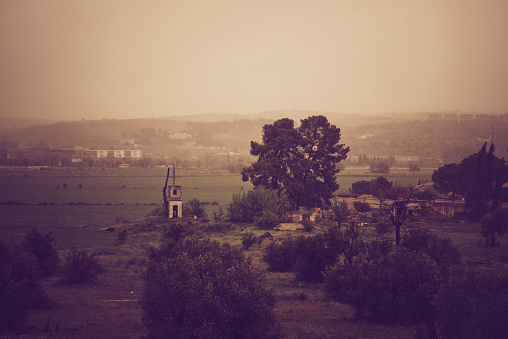 Sunrise in the vicinity of Toledo with fog in vintage tone