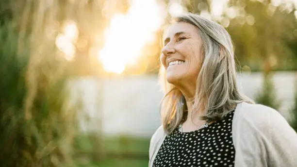 Senior woman portrait at sunset