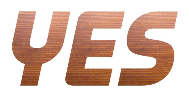 istock The word YES with brown wooden texture on white background. 1285331428