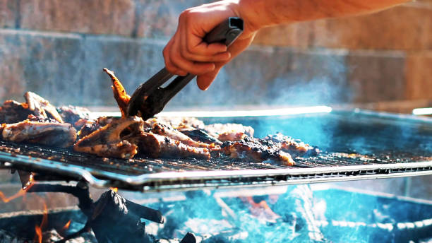istock man hand as he cooking meat on the barbecue 1285331521