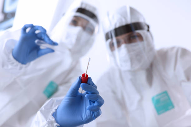 istock Two female doctor make covid 19 test with patiint 1285333578